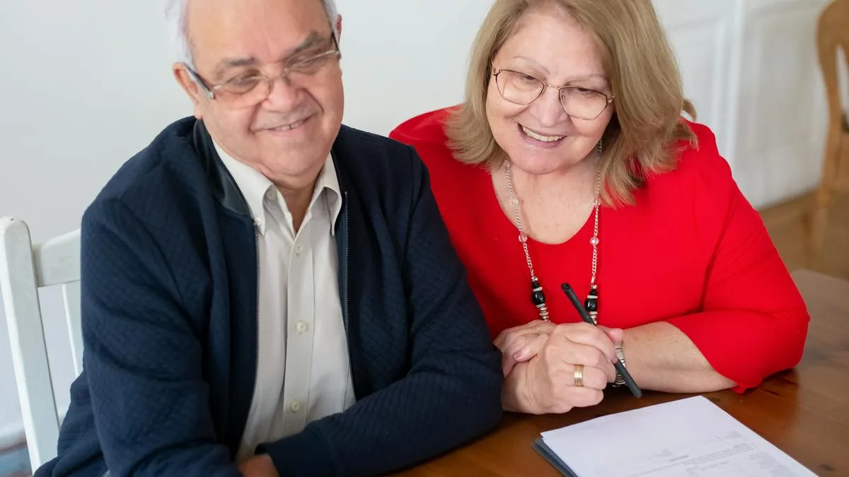 Senior couple reviewing finances together on a laptop